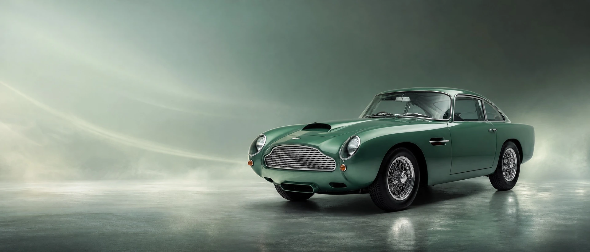An Aston Martin DB4 GT Continuation, front three-quarter view on a silver-green field with lifting mist