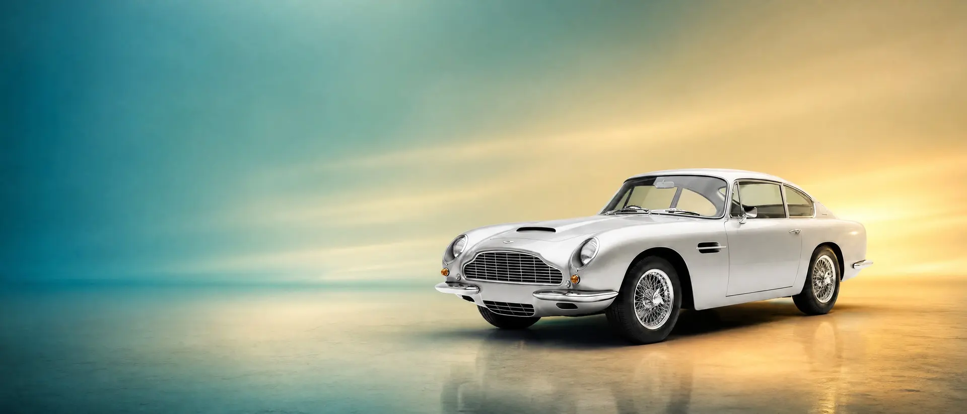 Aston Martin DB6 staged in a darkened scene