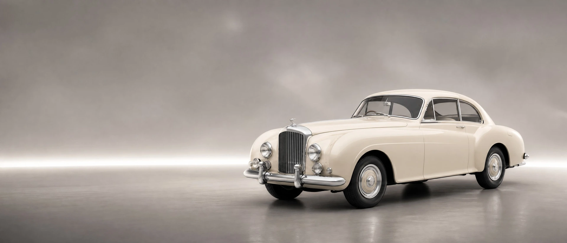 An ivory Bentley R-Type Continental, front three-quarter view on a pewter field with a silver light band