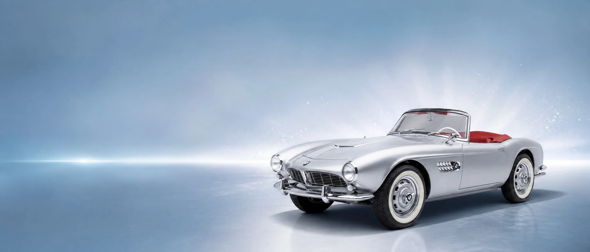 A silver BMW 507 roadster, front three-quarter view on an azure-silver field