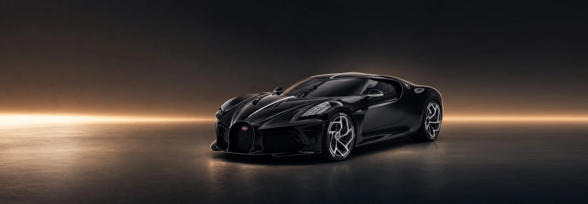 A black Bugatti La Voiture Noire, front three-quarter view on a graphite field with a warm horizon