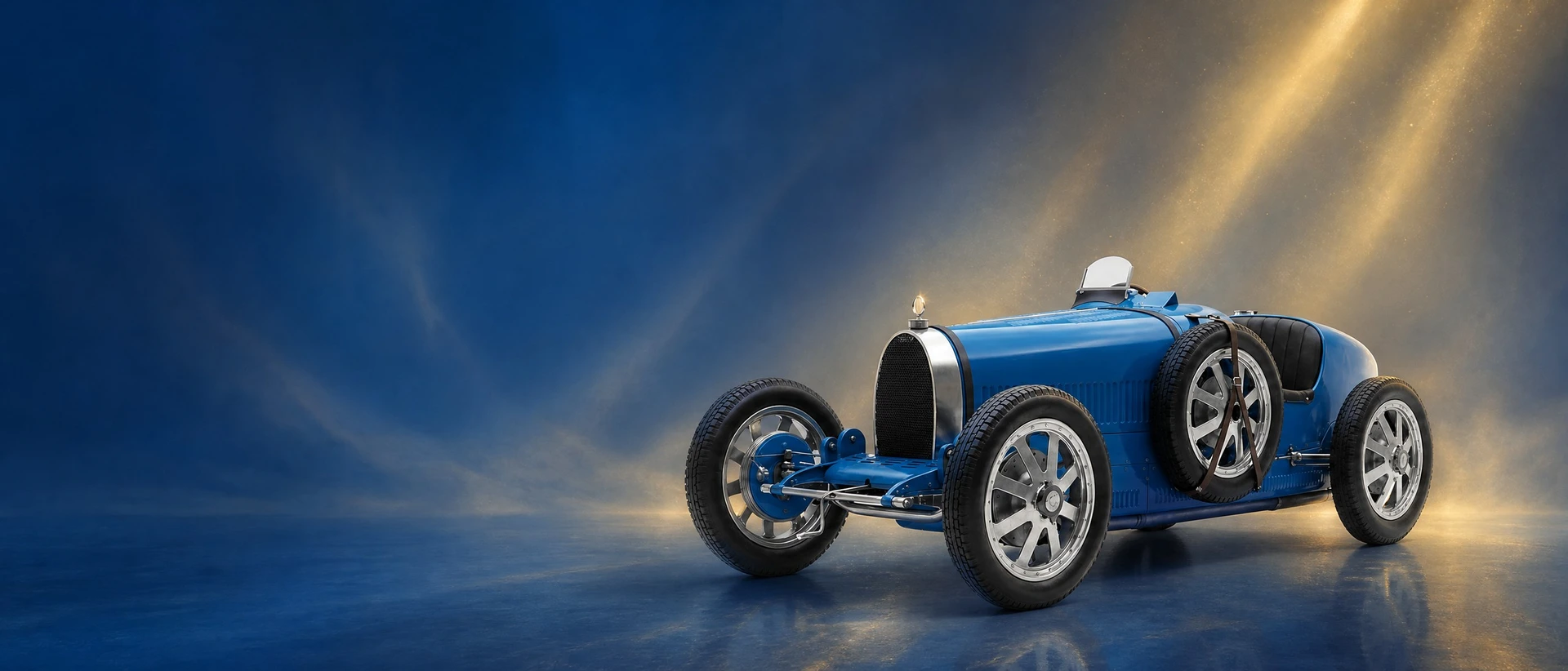 A French racing blue Bugatti Type 35, front three-quarter view on a French-blue field with golden dust