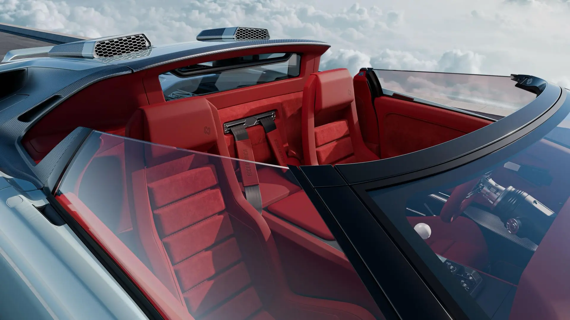 Detail of the Eccentrica V12 Roadster roll hoops and intake pods behind the open cockpit