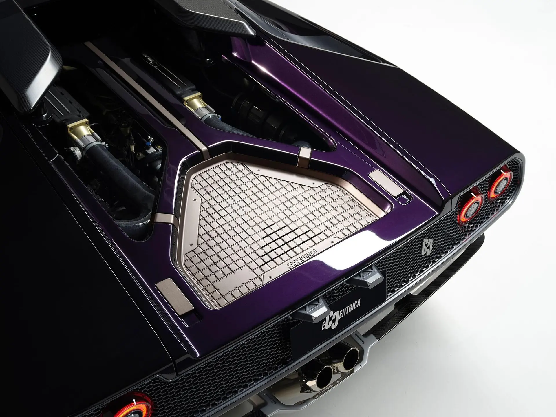 Eccentrica V12 rear deck open in the studio, naturally aspirated V12 and titanium heat shielding exposed