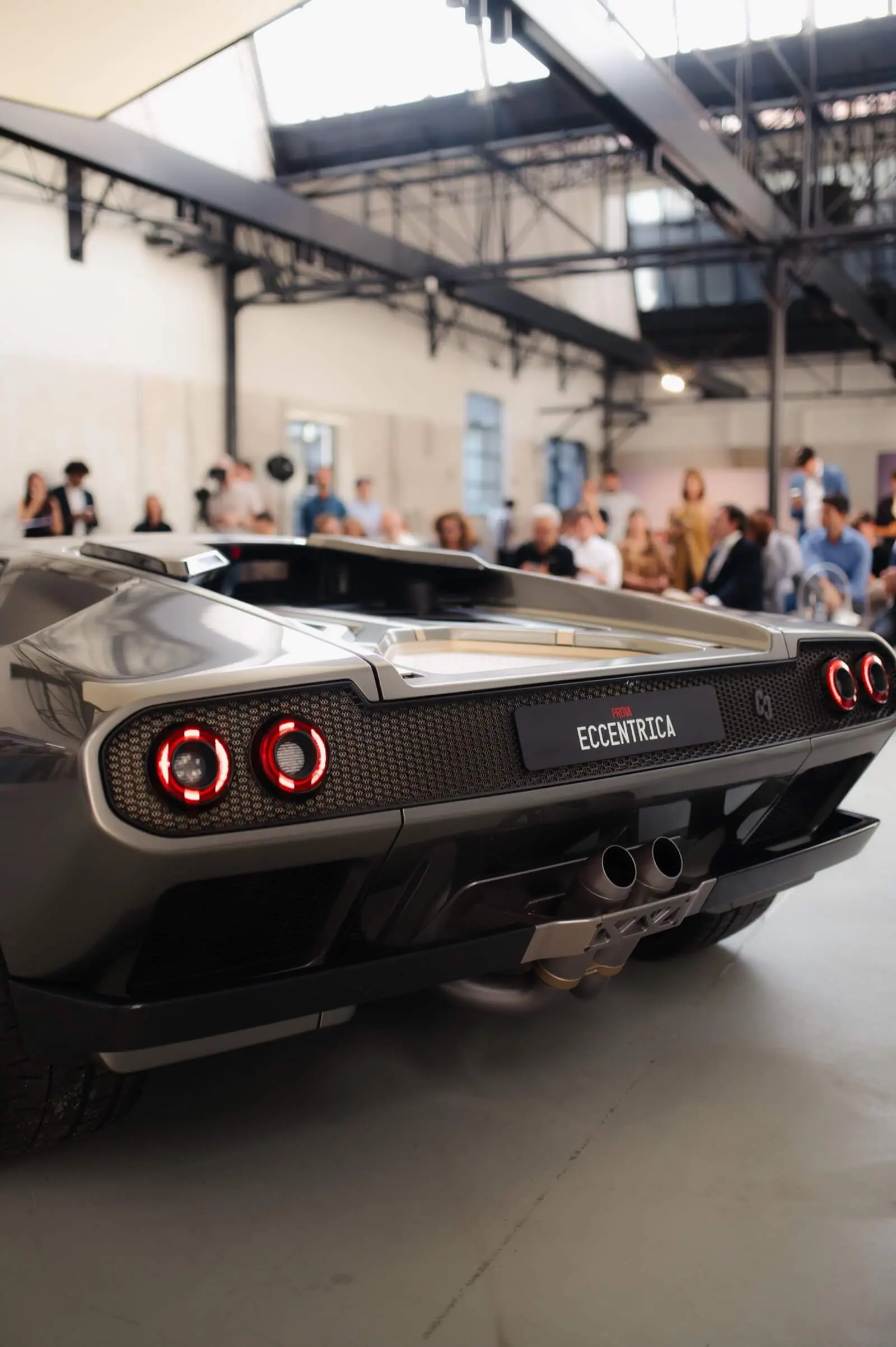 Eccentrica V12 rear view at the 2023 Milan unveiling, round tail lights and PROVA plate