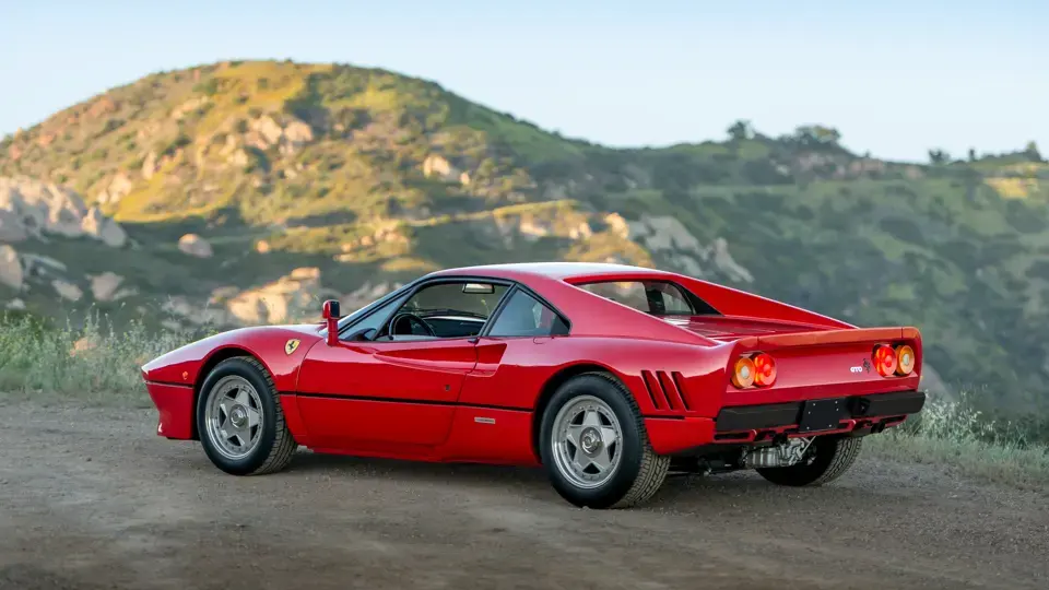GTO chassis 56773, rear three-quarter view on a hillside road