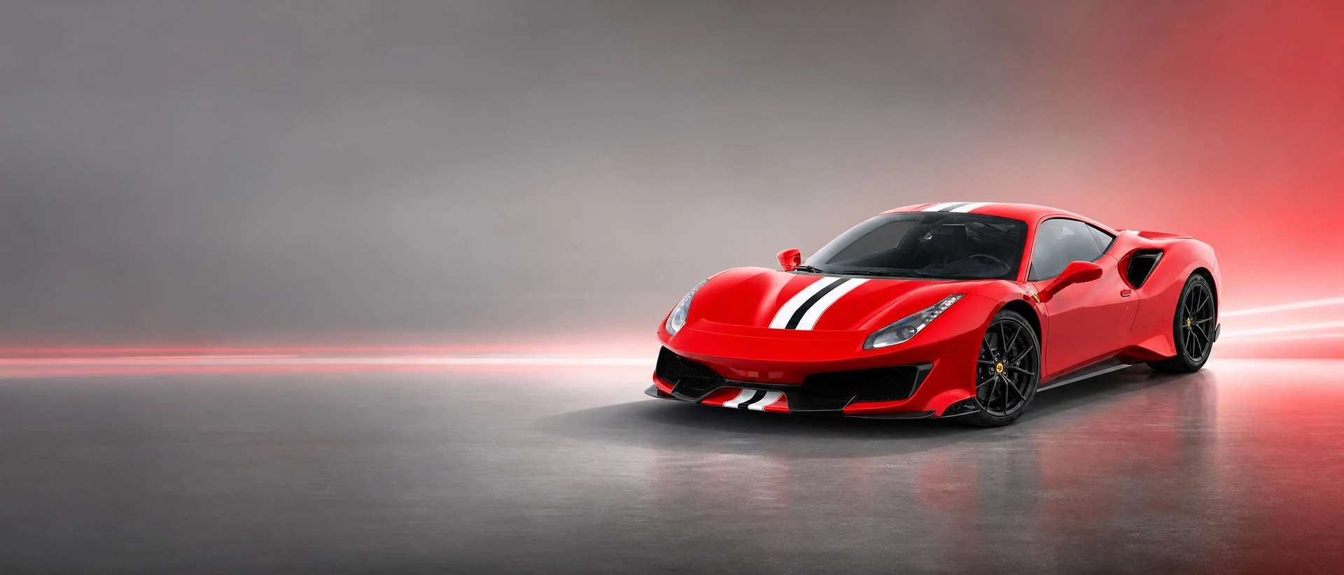 A red Ferrari 488 Pista, front three-quarter view on a carbon-grey field with twin light streaks