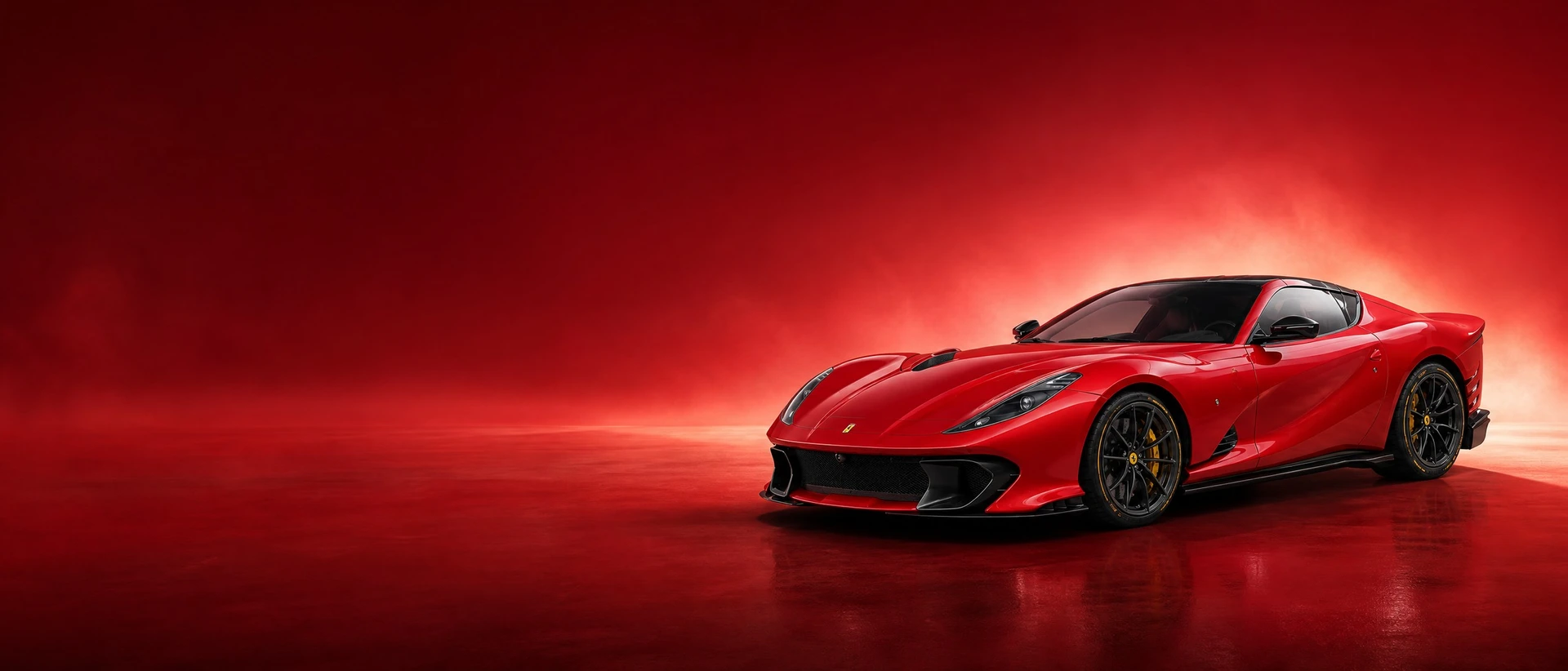 A red Ferrari 812 Competizione, front three-quarter view on a luminous red field with rising light