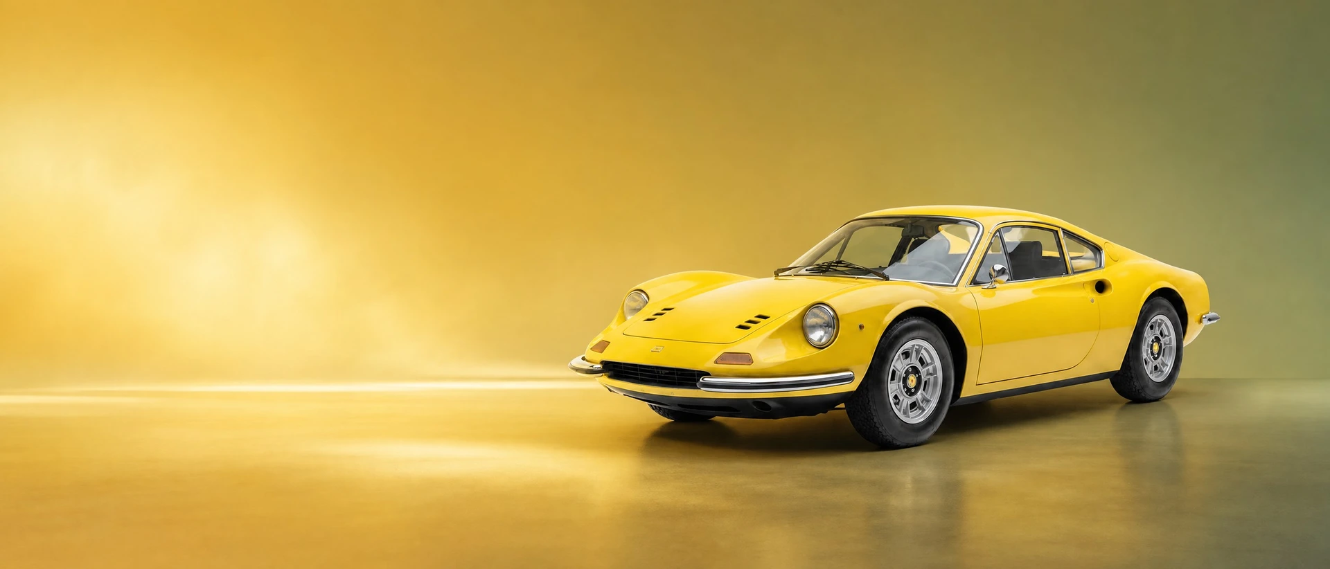 A yellow Ferrari Dino 246 GT, front three-quarter view on a green-gold gradient field