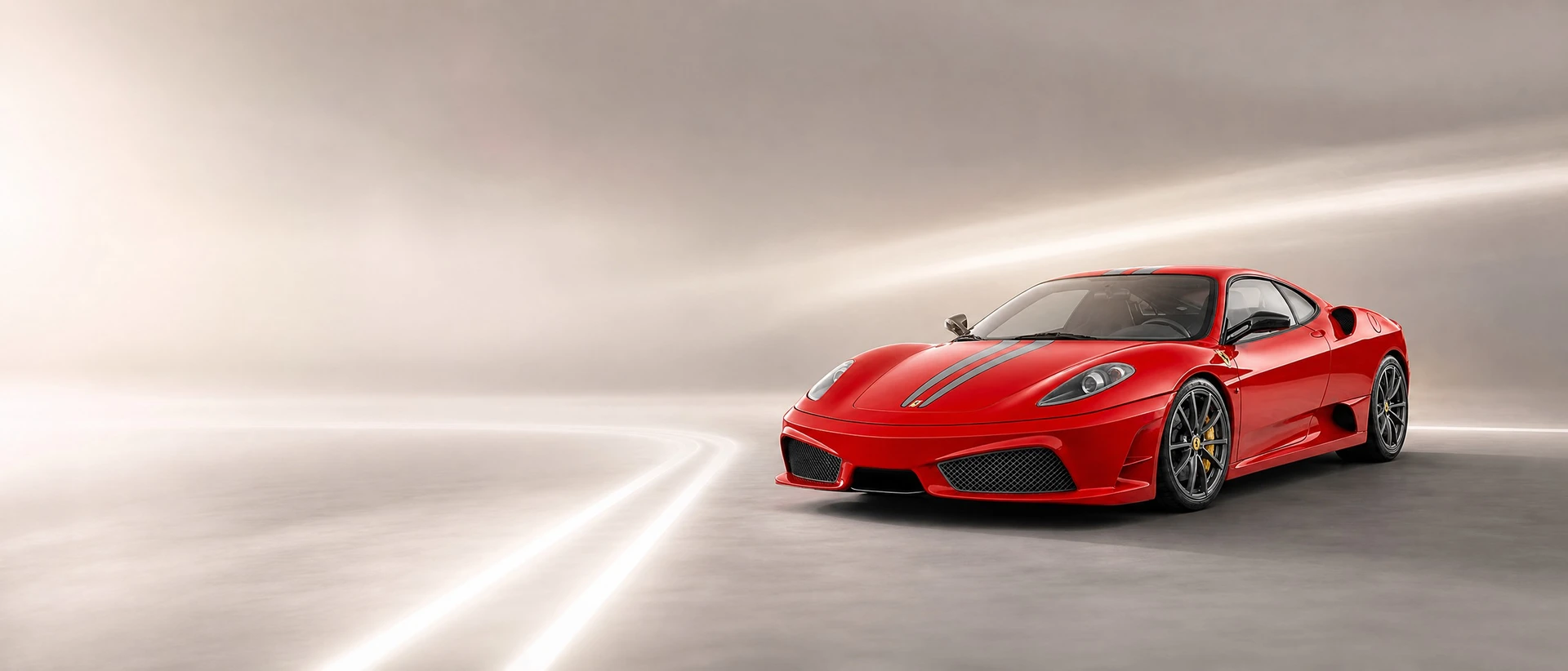 A red Ferrari 430 Scuderia with racing stripes, front three-quarter view on a bright field with double stripe light