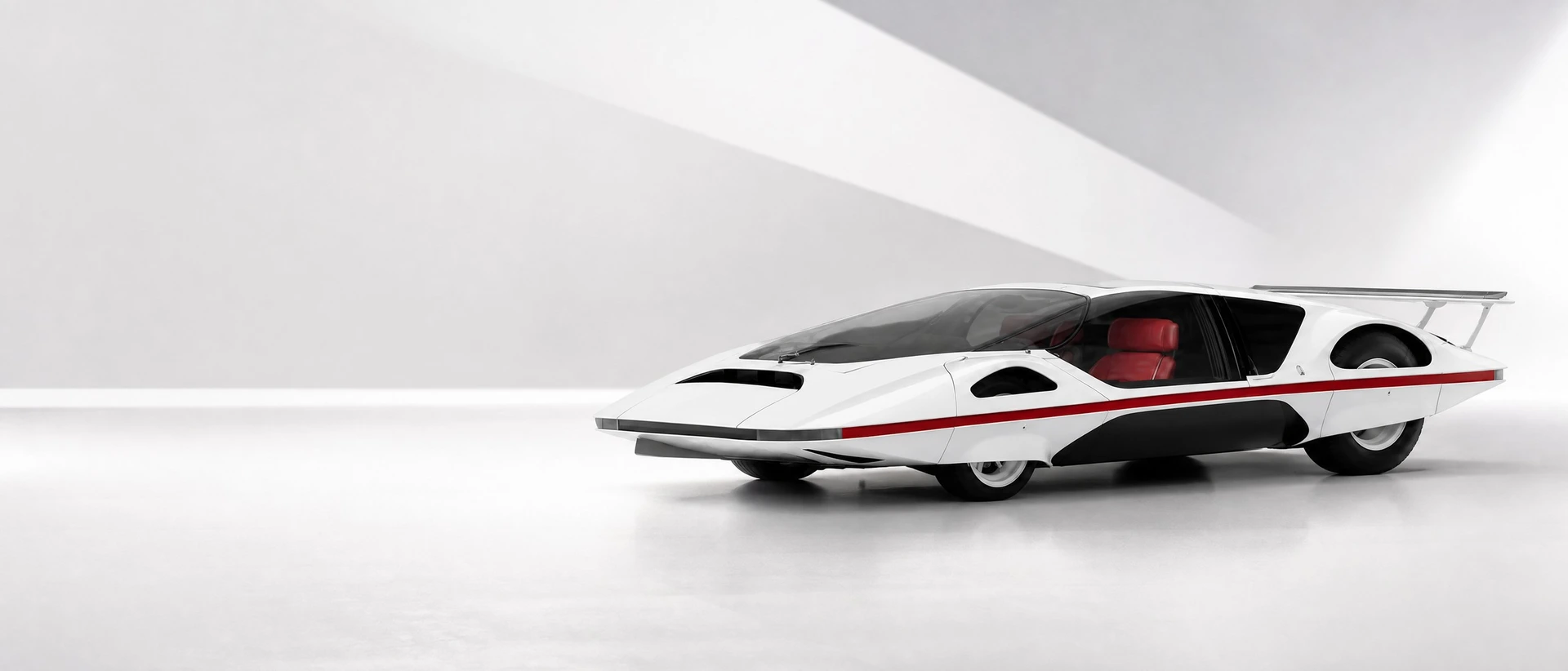 The white Pininfarina Ferrari Modulo concept, front three-quarter view on a pure white geometric field