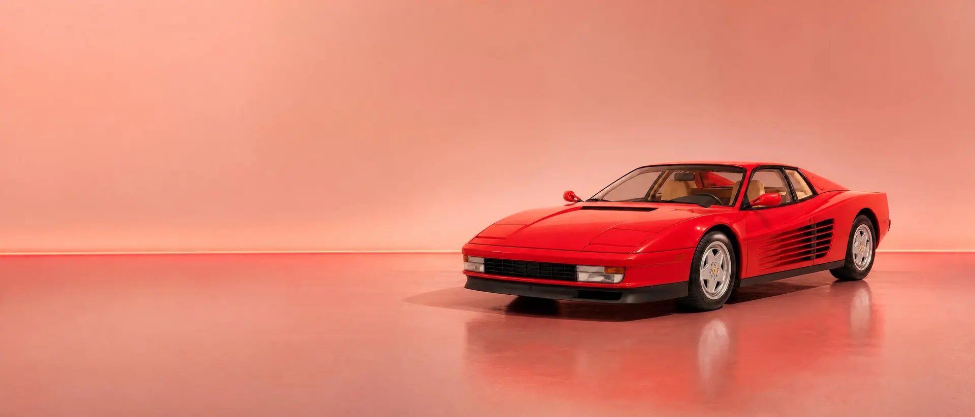 Ferrari Testarossa staged in a darkened scene