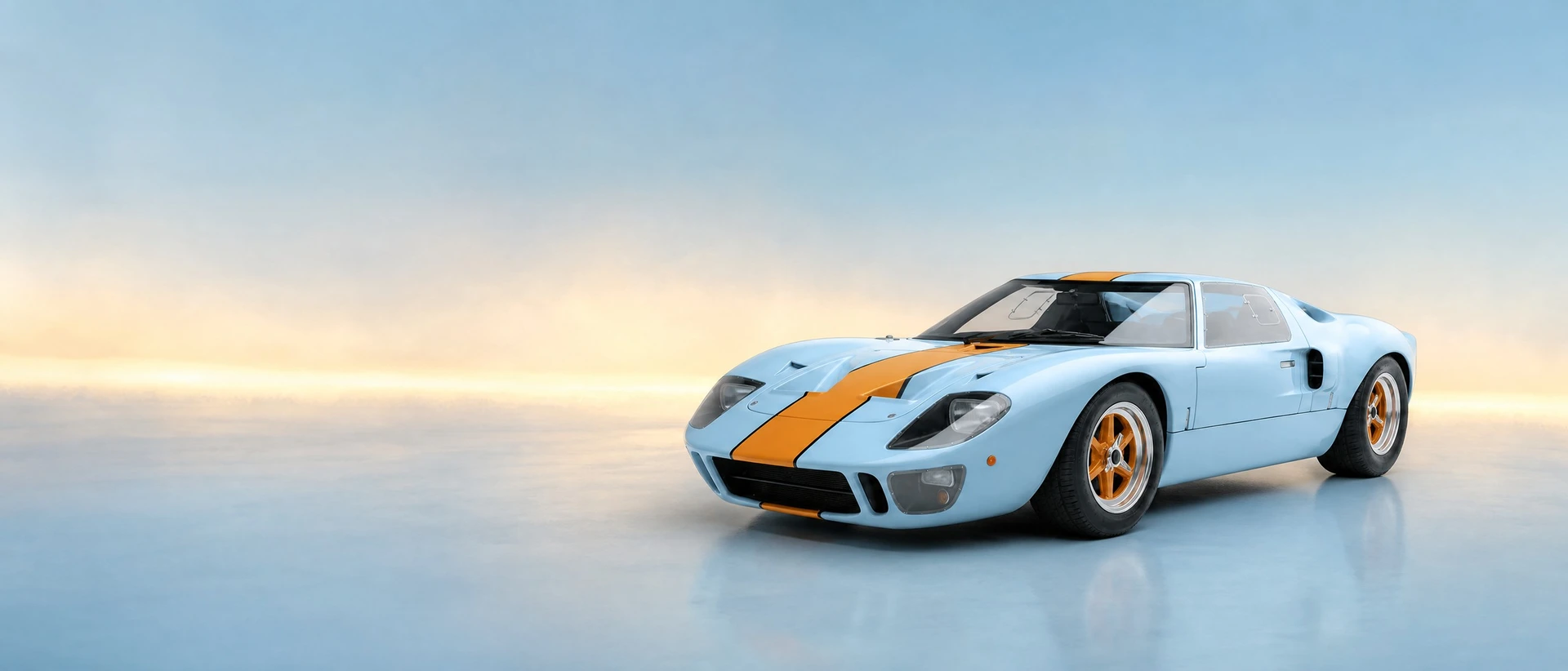 A light blue Ford GT40, front three-quarter view on a powder-blue field with a warm band of light