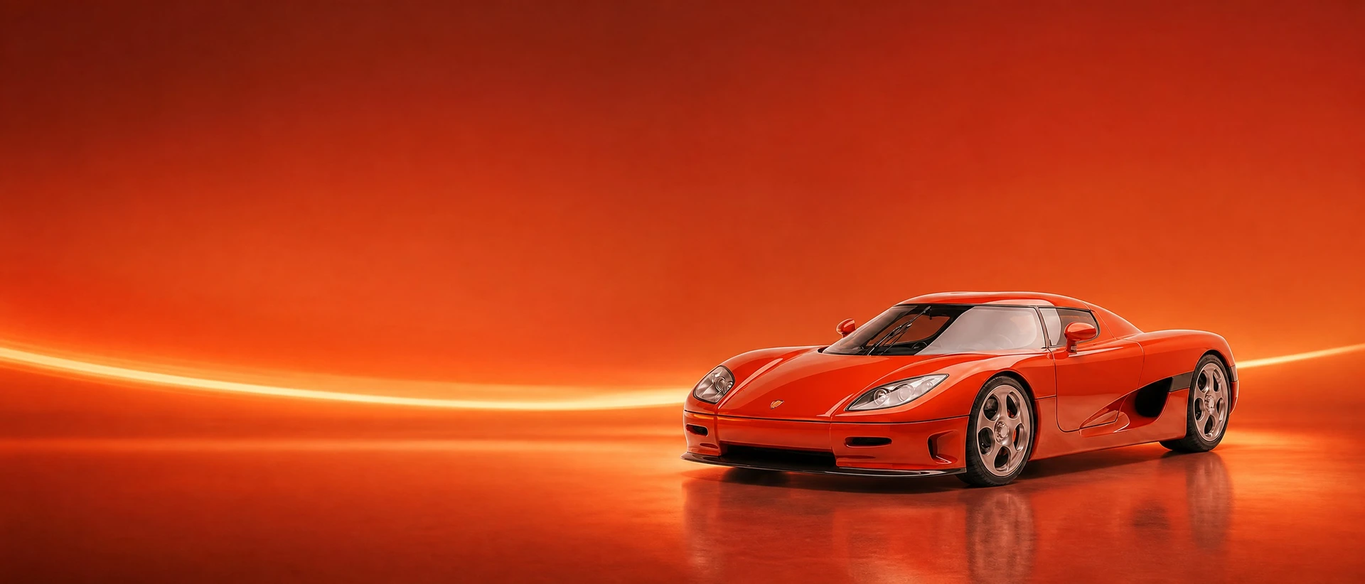 A Lava Orange Koenigsegg CCR, front three-quarter view on an orange field with a curved speed light