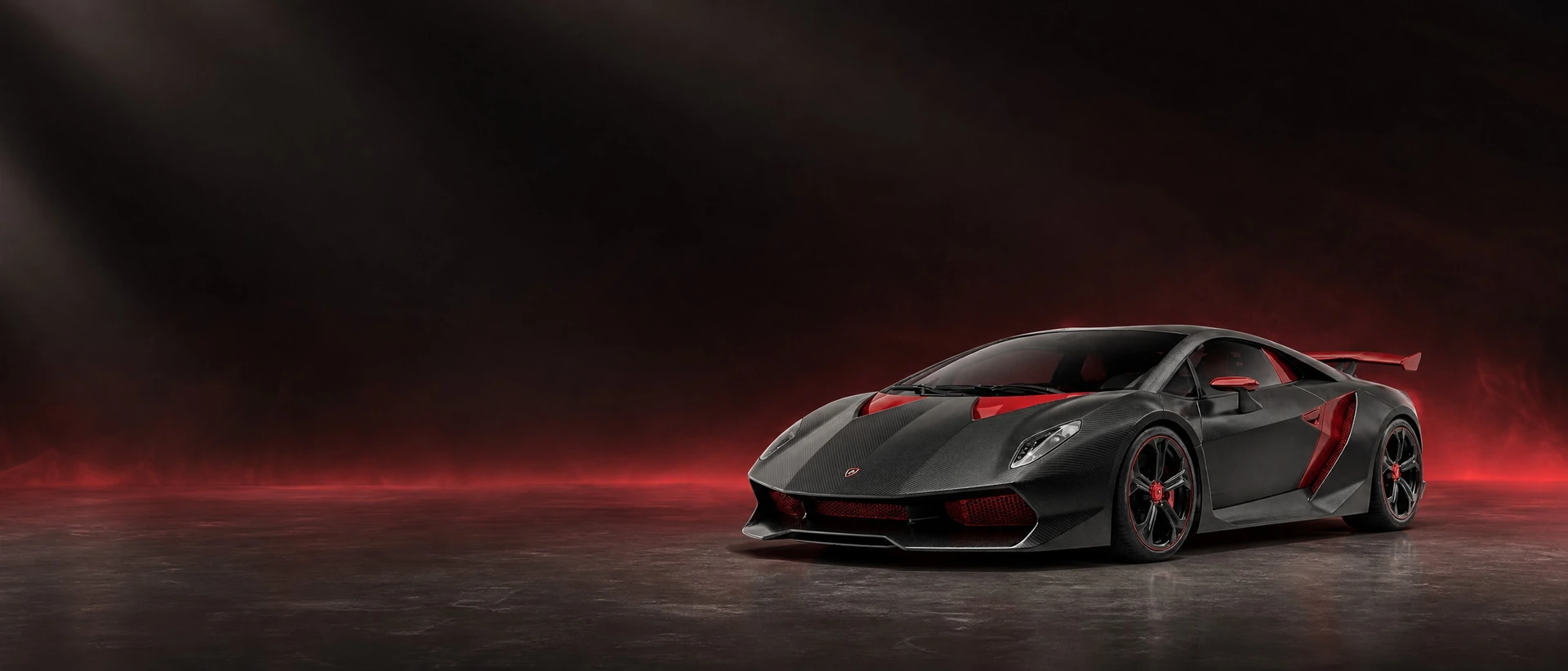 A dark carbon Lamborghini Sesto Elemento, front three-quarter view on a carbon field with an ember glow