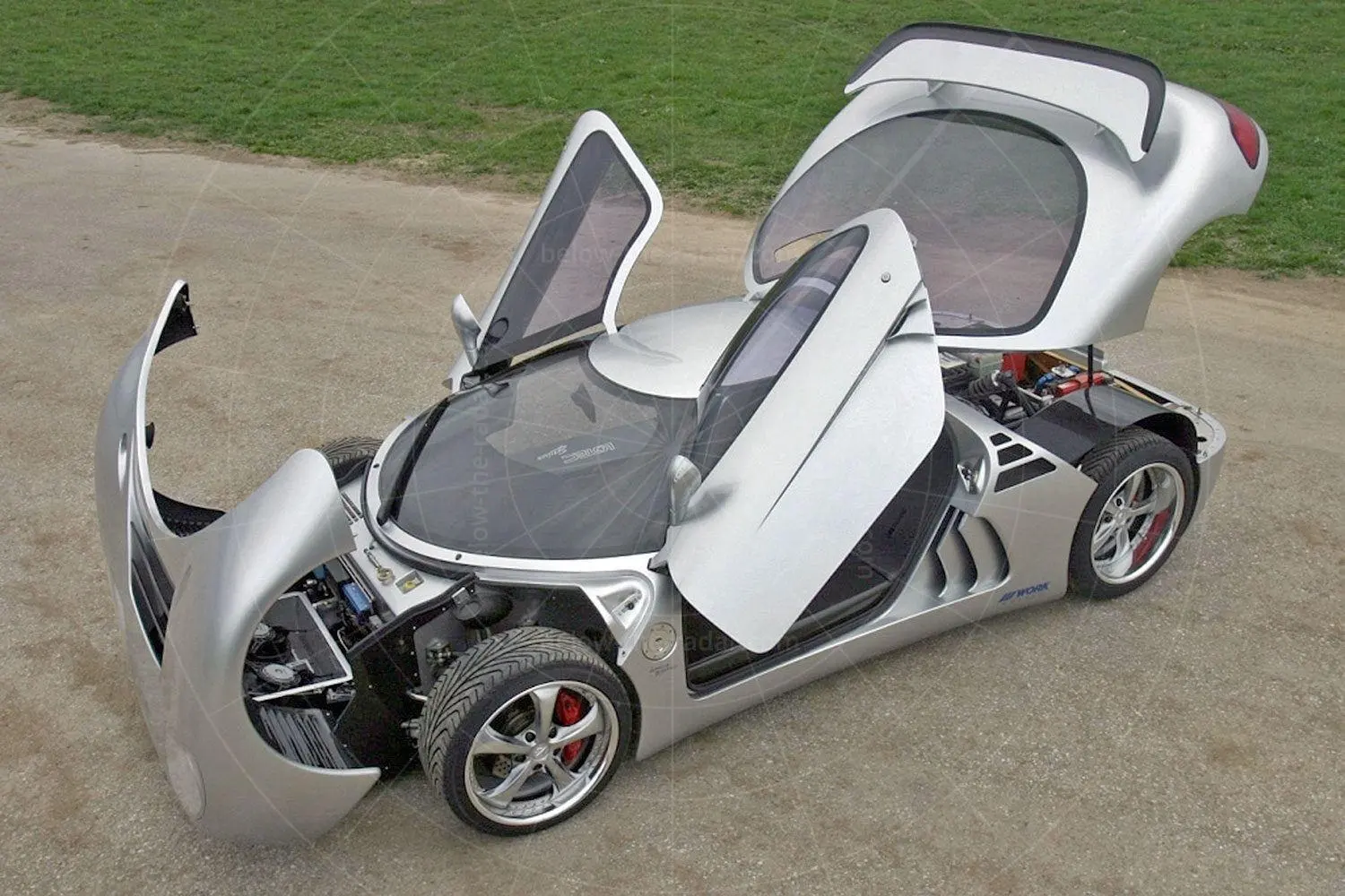 Sirius with doors and rear clamshell open, exposing the twin-turbo V12 installation