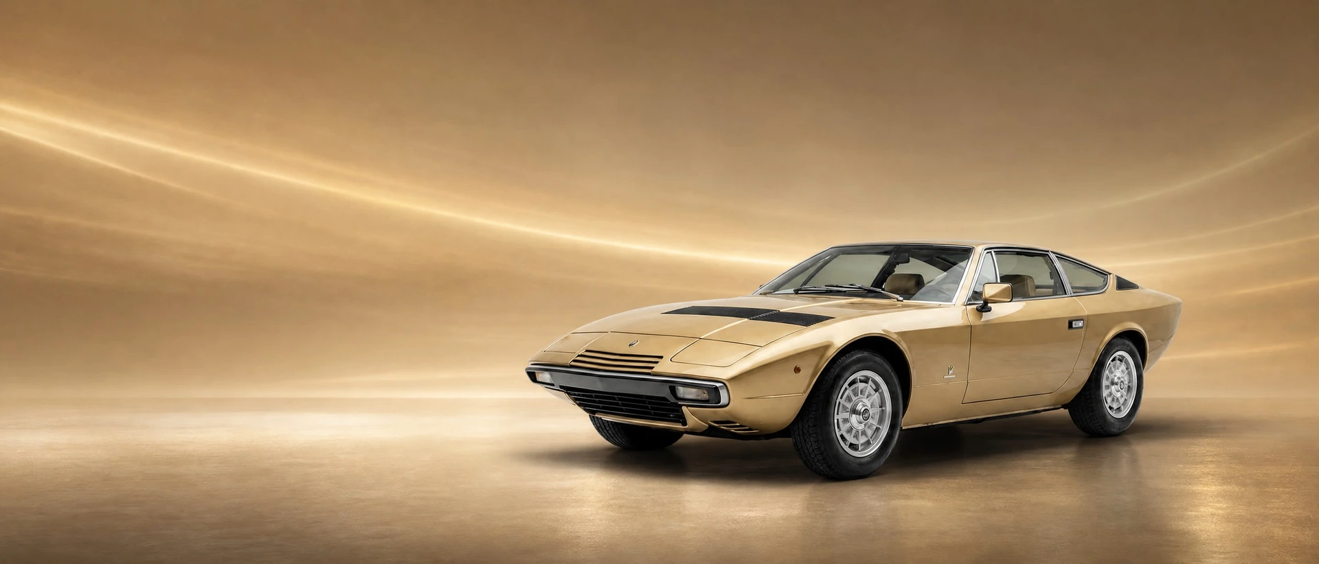 A Maserati Khamsin, front three-quarter view on a bronze field with wind-carried light