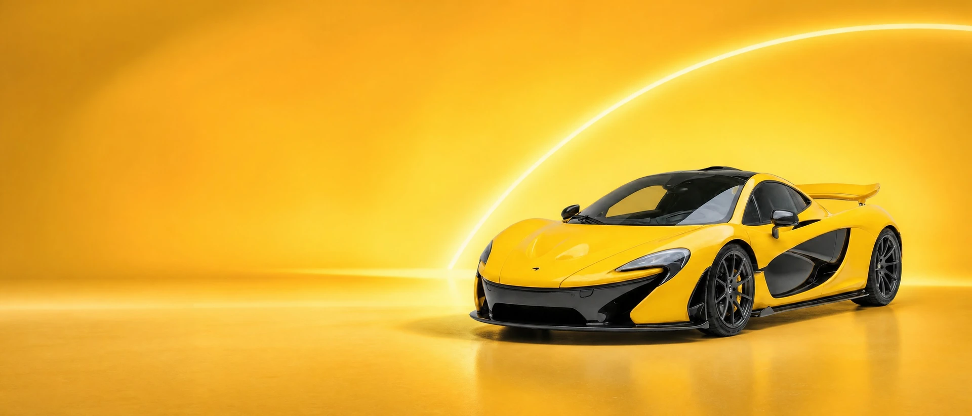 A yellow McLaren P1, front three-quarter view on a luminous yellow field with a white arc