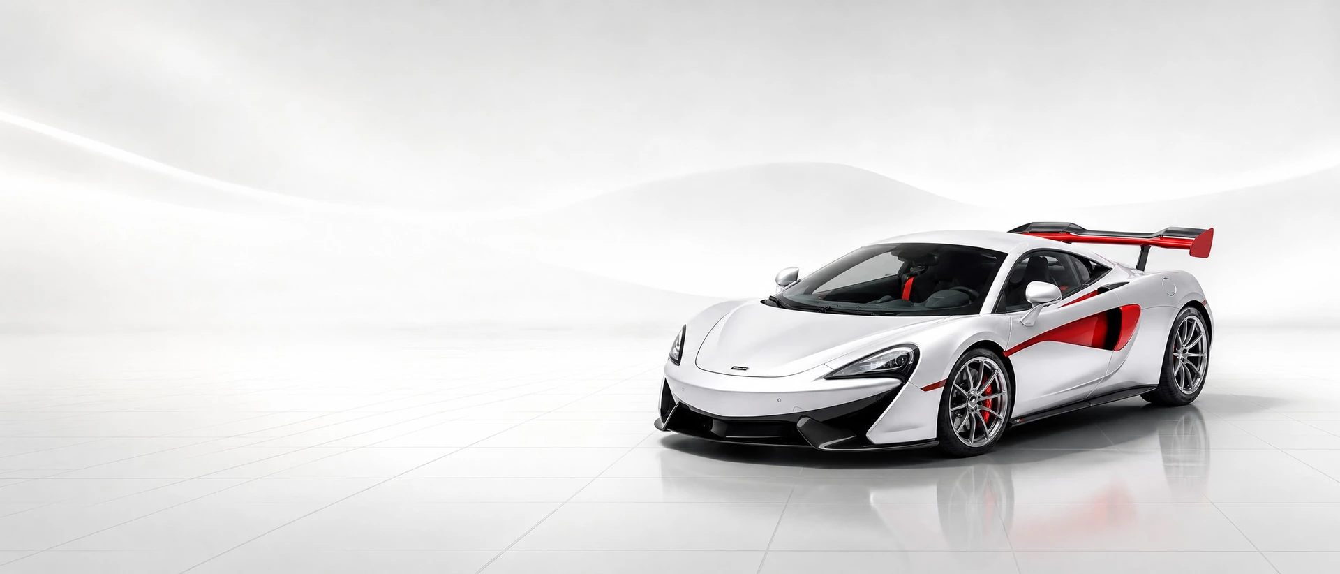 A red McLaren Solus GT, front three-quarter view on a white field with a perspective grid