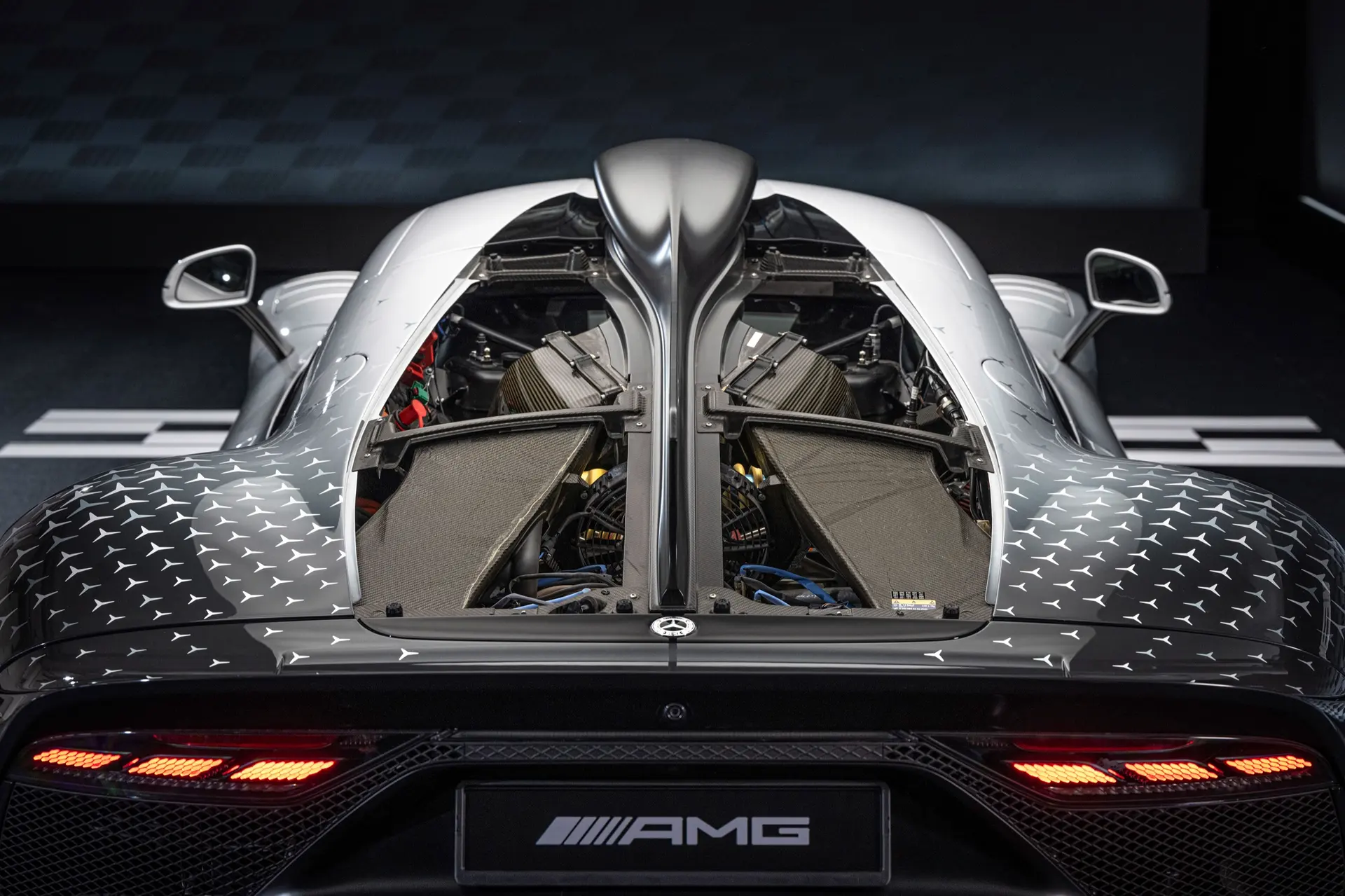 Mercedes-AMG ONE from the rear with its carbon powertrain covers open