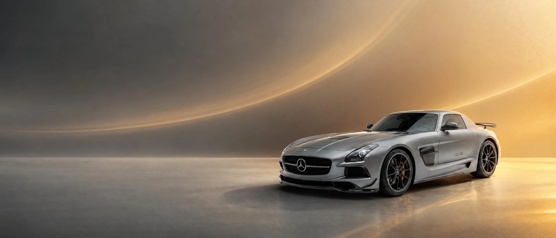 A Mercedes-Benz SLS AMG Black Series, front three-quarter view on a charcoal-amber field with heat shimmer