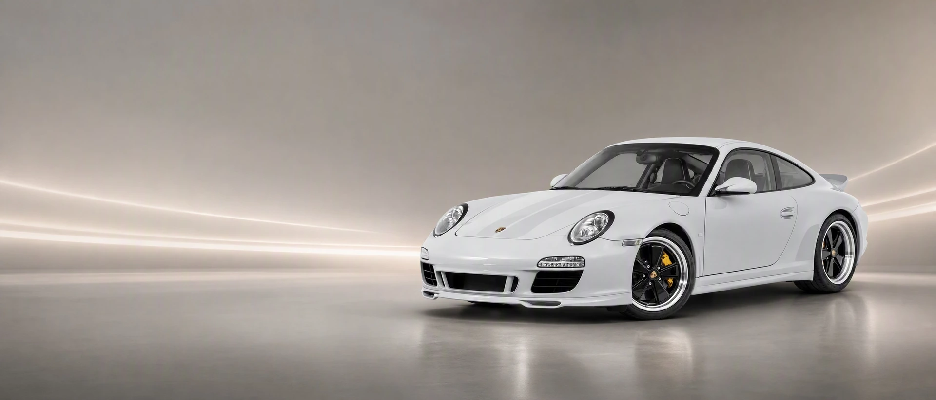 A grey Porsche 911 Sport Classic, front three-quarter view on a grey field with a stripe of light