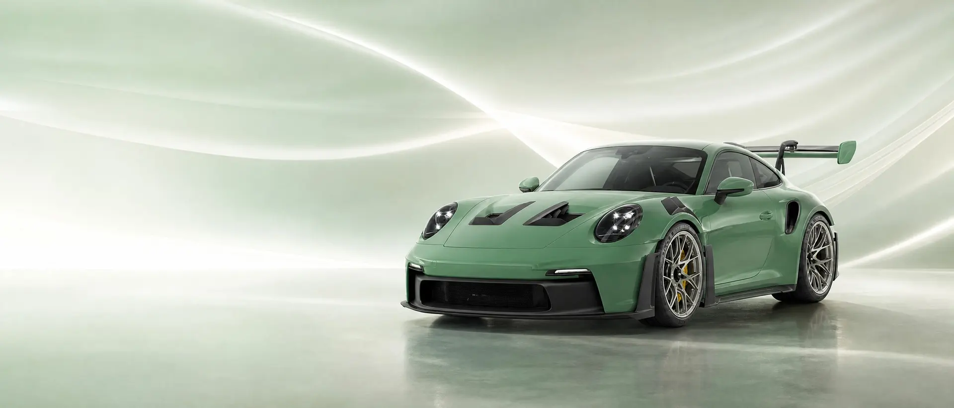 Porsche 992 GT3 RS staged in a darkened scene