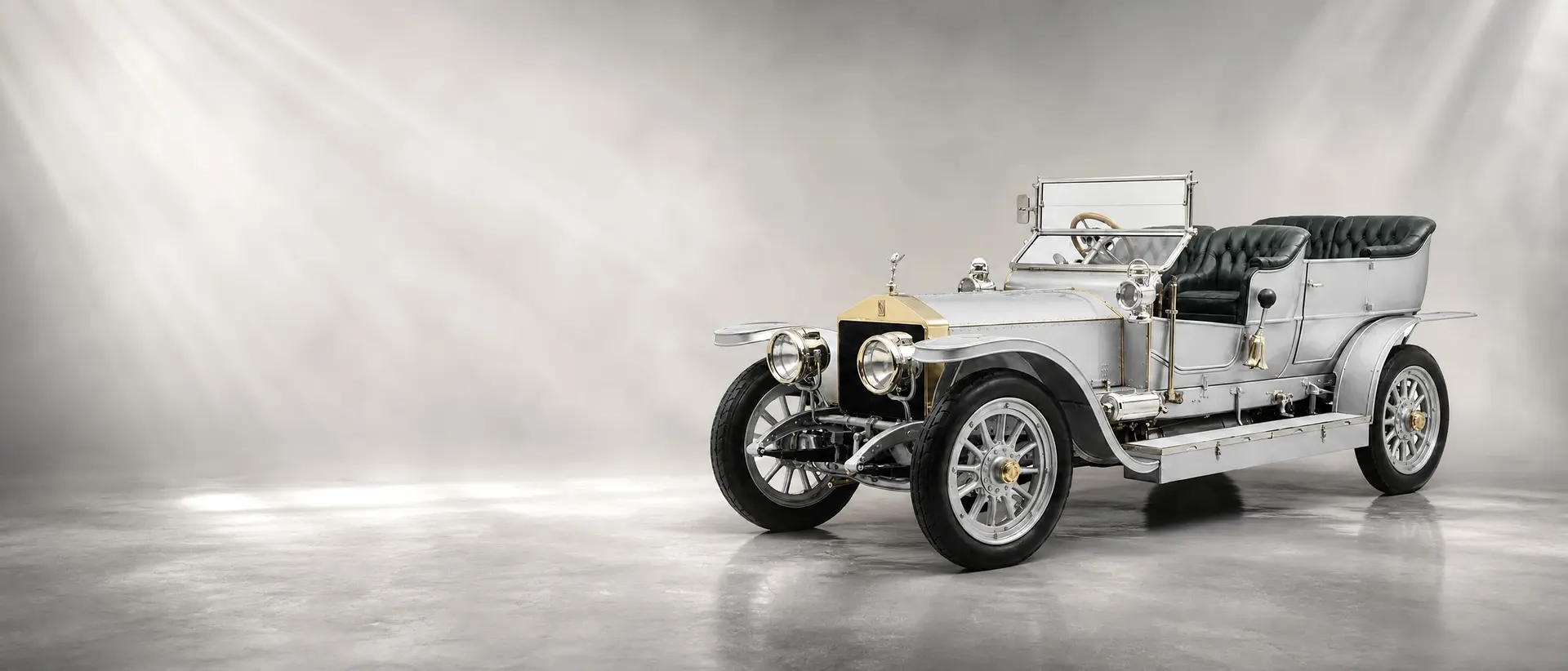 Rolls-Royce Silver Ghost staged in a darkened scene